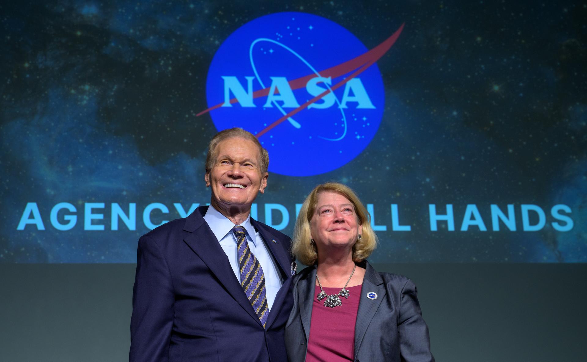 NASA Administrator Bill Nelson, and NASA Deputy Administrator Pam Melroy, react as they are recognized by employees during a NASA agencywide all hands on Dec. 6, 2024, at the NASA Headquarters Mary W. Jackson Building in Washington.