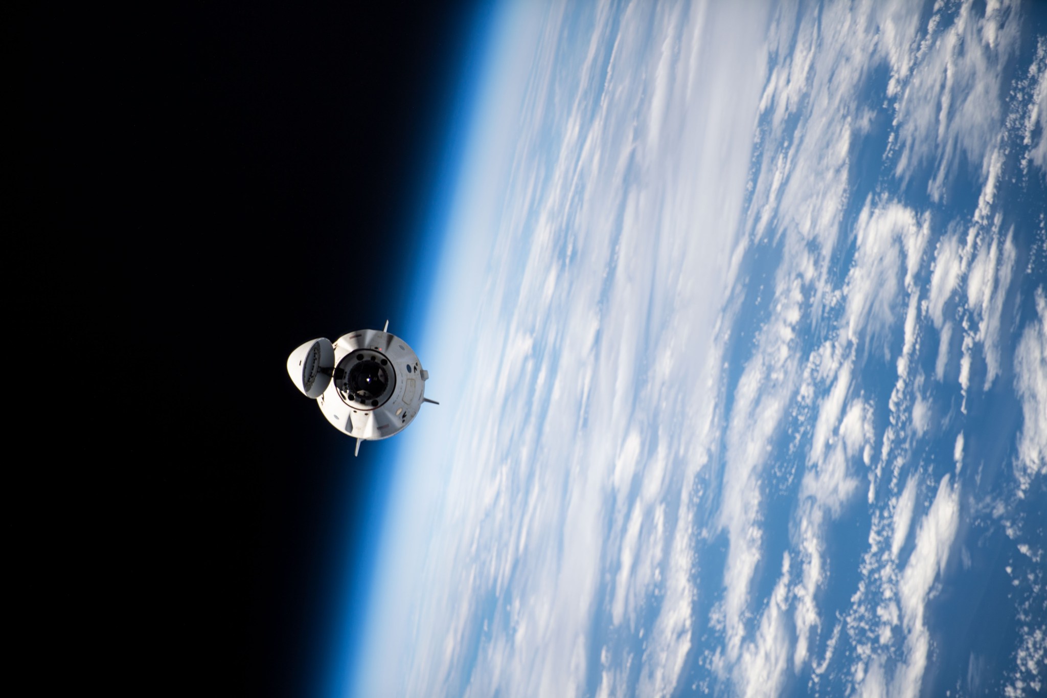 The SpaceX Dragon spacecraft departs the International Space Station as it orbits 264 miles above the south Pacific Ocean northeast of New Zealand.