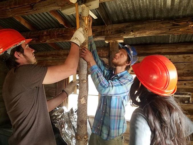Title: Roof Stabilization - Description: Students from Dr. Lee’s fall 2017 Wilderness Management class adding support beams to stabilize the damaged roof at Kendrick Mountain Cabin. Credit Kaibab National Forest.