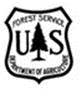 Title: Forest Service logo - Description: Logo that reads:" Forest Service U S Department of Agriculture" all enclosed in a shield shape with a tree shape in the middle.