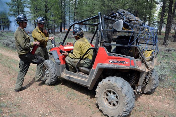 Title: Firefighers Discuss Strategy - Description: Firefighters discuss strategy prior to the day's operations on the resource-benefit fires on the Tusayan Ranger District. (Photo credit: USFS/Dyan Bone)